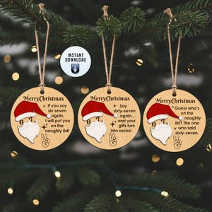 May include: Three wooden Christmas ornaments with Santa Claus designs. Each ornament has a red hat, white beard, and the number 67. The ornaments have different humorous phrases about the naughty list and gifts.