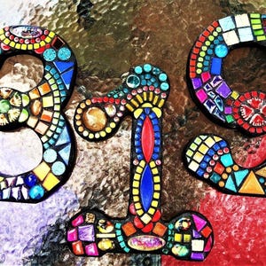 a vibrant mosaic design composed of colorful tiles arranged in the shape of the numbers '3' and '19', creating a visually striking and intricate pattern.