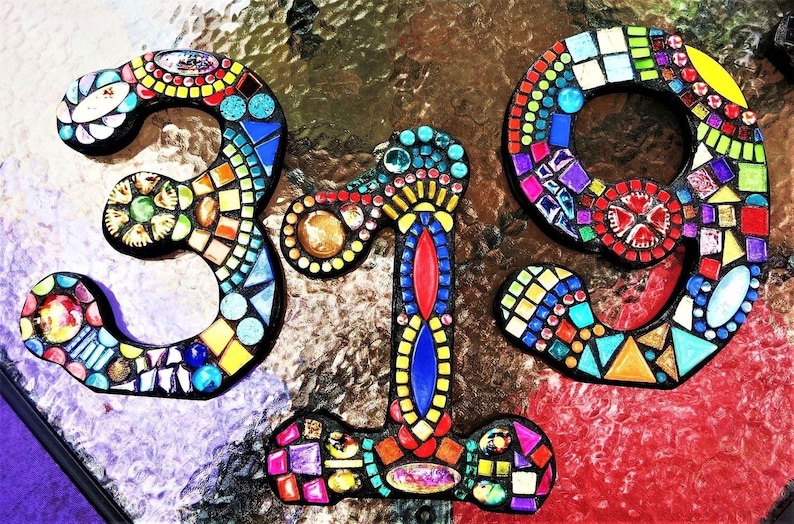 a vibrant mosaic design composed of colorful tiles arranged in the shape of the numbers '3' and '19', creating a visually striking and intricate pattern.