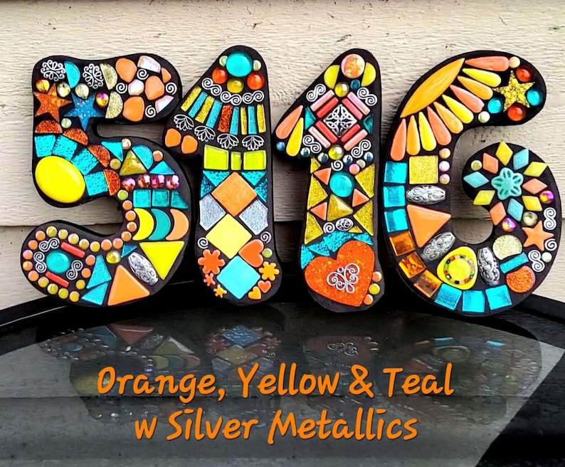a creative and colorful display made up of various mosaic tiles in the shape of the numbers 5, 1, and 6. The tiles are arranged in a visually appealing manner, showcasing a variety of colors and patterns. The image is described as a collage of multiple images, and it is not a single image but a collection of different images that come together to form the number 5, 1, and 6.