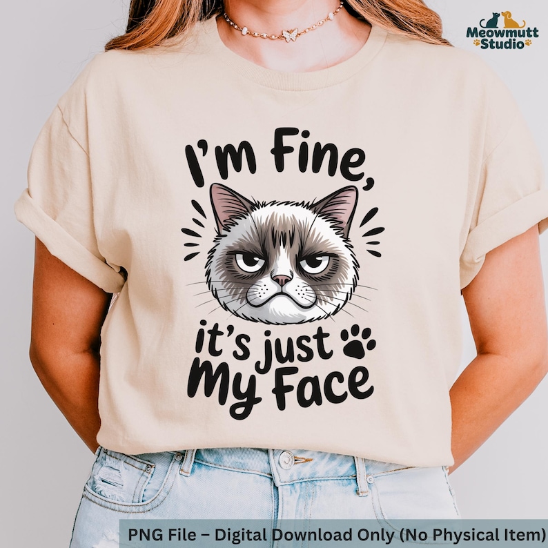 May include: A beige t-shirt featuring a grumpy cat face graphic with the text "I'm Fine, it's just My Face." The design includes paw prints and radiating lines. The shirt is a digital download.