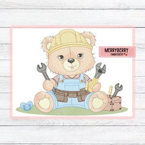 May include: Embroidered design of a teddy bear wearing a yellow construction hat and blue overalls, holding wrenches. A brown tool belt and a wooden toolbox with tools are also present. A blue pacifier is on the left. The text "MERRYBERRY EMBROIDERY" is on the right.
