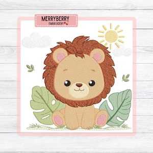 May include: An embroidered design featuring a cute cartoon lion cub with a brown mane, sitting among green leaves and grass. A yellow sun and white clouds are in the background. The text "MERRYBERRY EMBROIDERY" is at the top.
