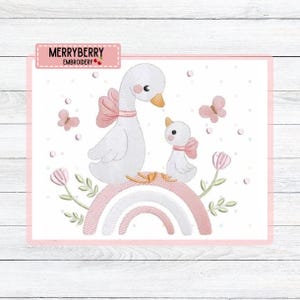 May include: An embroidered design featuring a mother goose and gosling with pink bows, standing on a pink and white rainbow. Pink butterflies and flowers surround the geese. The text "MERRYBERRY EMBROIDERY" is in the upper left corner.