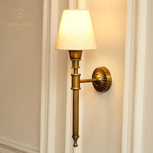 Antique Brass Wall Lamp: Mid-Century Modern Sconce with Off-White Shade