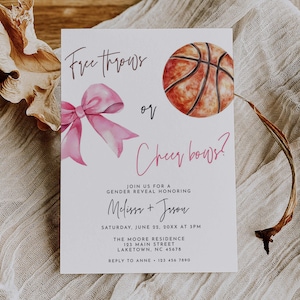 May include: A gender reveal invitation with watercolor illustrations. The design features a pink bow and a basketball, with text that reads "Free throws or Cheer bows?" and event details. The invitation is on a white background.