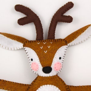 Close up of a hand made felt deer