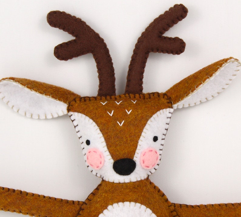 Close up of a hand made felt deer