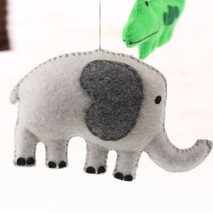 Close up of hand sewn elephant in jungle animals mobile