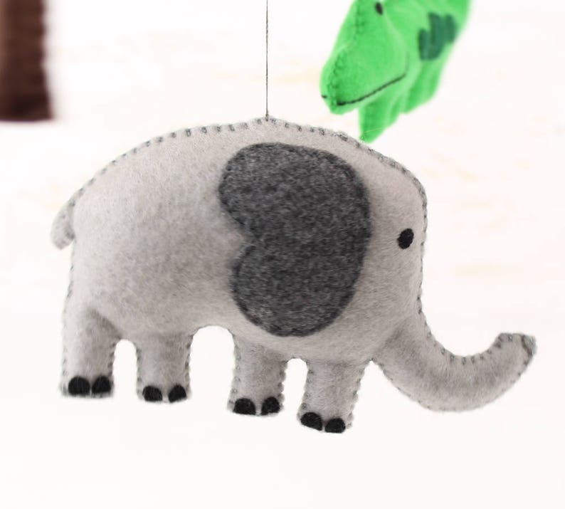 Close up of hand sewn elephant in jungle animals mobile