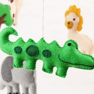 Close up of hand sewn crocodile in jungle animals mobile