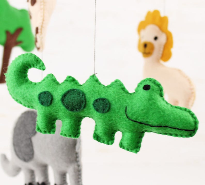 Close up of hand sewn crocodile in jungle animals mobile