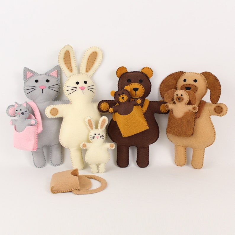 Felt stuffed animals: cat, rabbit, bear, and dog. They each a have a miniature version of themselves.