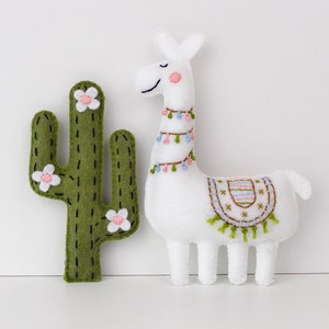 Ornately decorated hand-sewn felt cactus and llama