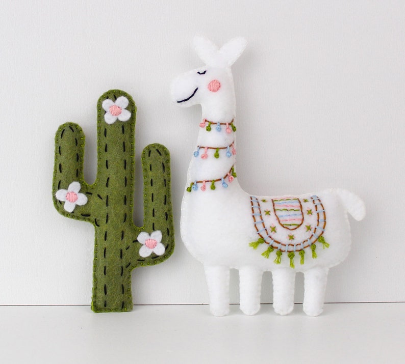 Ornately decorated hand-sewn felt cactus and llama