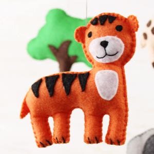 Close up of hand sewn tiger in jungle animals mobile