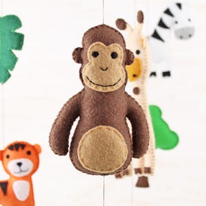 Close up of hand sewn monkey in jungle animals mobile