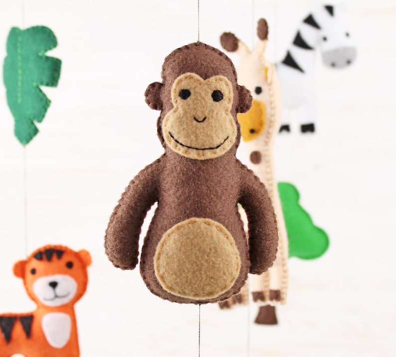 Close up of hand sewn monkey in jungle animals mobile