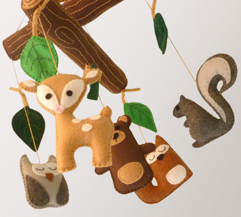 Woodland forest themed nursery mobile with hand sewn logs and leaves, and a baby deer, owl, bear, fox, and squirrel