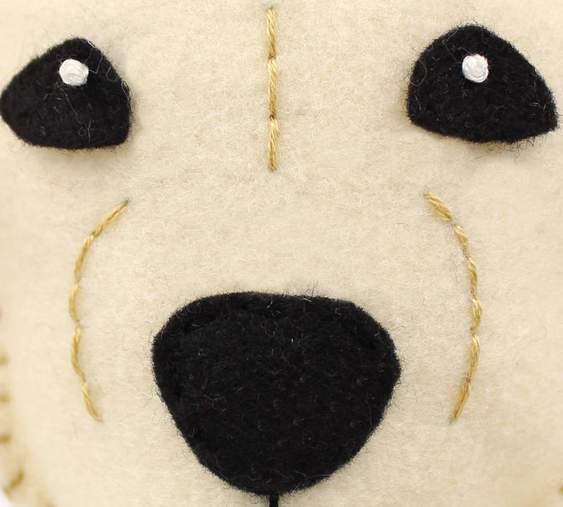 Face details of handmade golden lab puppy stuffed animal