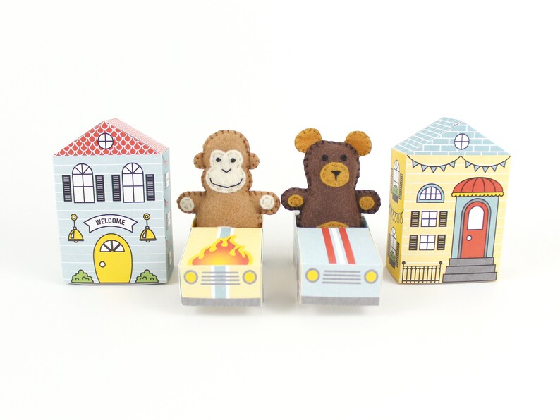 A tiny hand sewn felt monkey and bear, with printable paper cars and houses