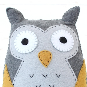 Handmade yellow and gray felt owl