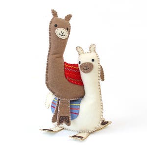 Two felt llamas stacked on one another