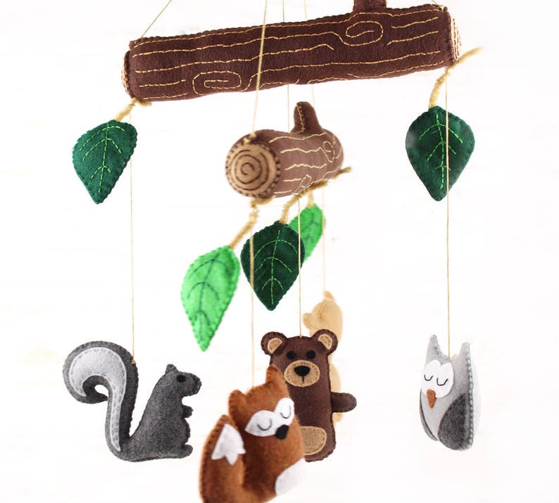 Side view of handmade felt forest mobile