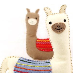 Two felt hand sewn llamas