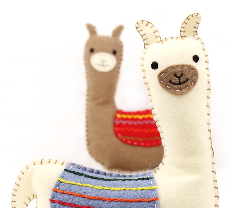 Two felt hand sewn llamas