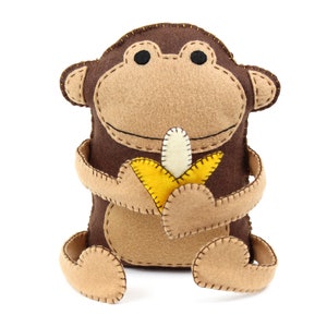 Hand sewing pattern for a stuffed felt monkey with bendy arms and a banana