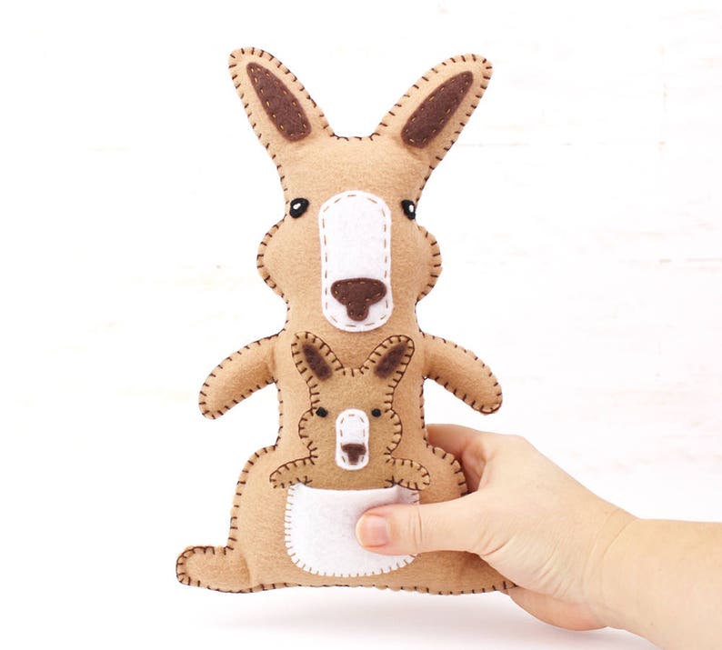 Felt kangaroo and joey held in a hand