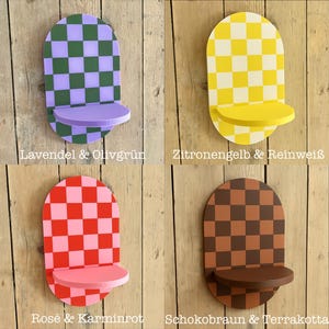 May include: Four decorative wall shelves with a checkerboard pattern in various colors: green and purple, yellow and white, red and pink, and brown and dark brown. Each shelf has a rounded top and a small, circular shelf.
