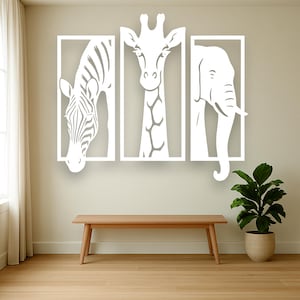 May include: White wall art set featuring a zebra, giraffe, and elephant, each within a rectangular frame. The animals are depicted in a minimalist style, creating a modern and clean aesthetic. The artwork is mounted on a neutral-colored wall above a wooden bench.