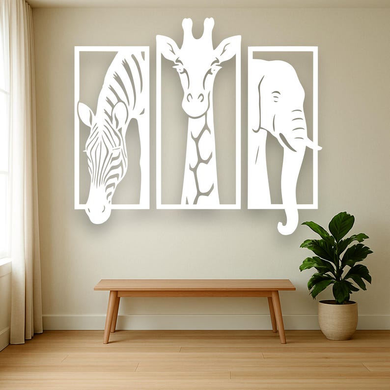 May include: White wall art set featuring a zebra, giraffe, and elephant, each within a rectangular frame. The animals are depicted in a minimalist style, creating a modern and clean aesthetic. The artwork is mounted on a neutral-colored wall above a wooden bench.