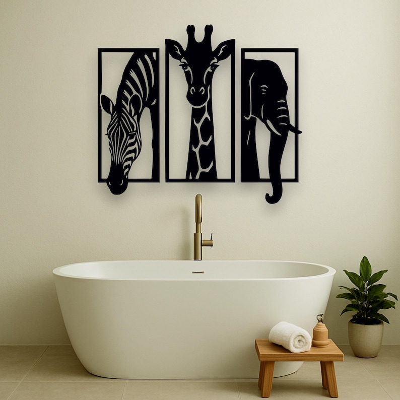 May include: Black metal wall art featuring a zebra, giraffe, and elephant, each within a rectangular frame. The artwork is mounted above a white bathtub in a bathroom setting. The zebra has black and white stripes, the giraffe has a long neck, and the elephant has a curved trunk.