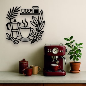 May include: A black metal wall art piece with a coffee theme, including a coffee cup, coffee beans, and a coffee pot. A red espresso machine, mugs, and a potted plant are also visible.