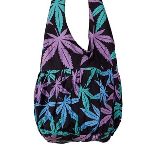 May include: A black cotton tote bag with a purple, blue, and green marijuana leaf pattern.