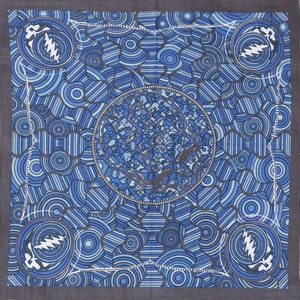 May include: A blue and gray bandana with a circular pattern and a stylized lightning bolt design. The bandana features a repeating pattern of circles and lines.