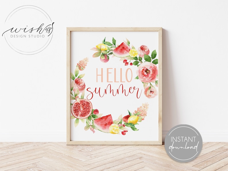 May include: A watercolor print with a floral wreath featuring watermelon, lemons, pomegranates, and the text "Hello Summer".