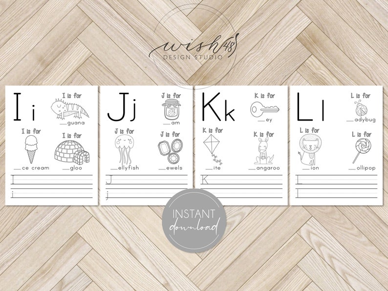 May include: Black and white printable alphabet flashcards for kids. Each card features a letter of the alphabet, a picture of an object that starts with that letter, and the word for the object. The words "I is for iguana", "J is for jam", "K is for key", and "L is for ladybug" are visible on the cards.