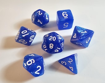 May include: A set of seven blue polyhedral dice with white numbering. The dice are various shapes, including a d4, d6, d8, d10, d12, d20, and a second d6. The dice have a shimmery, translucent appearance.