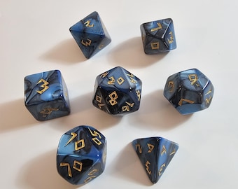 May include: Set of seven polyhedral dice in shades of blue with gold numbering. The dice have a marbled appearance and are designed for tabletop role-playing games. The dice include a d4, d6, d8, d10, d12, d20, and a percentile die.