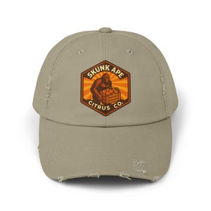 Skunk Ape Citrus Co. Hatt | Basebollkeps med nötter och kryptidfärgad bonde