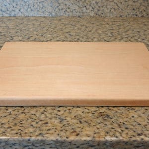 Maple cutting board on a granite countertop