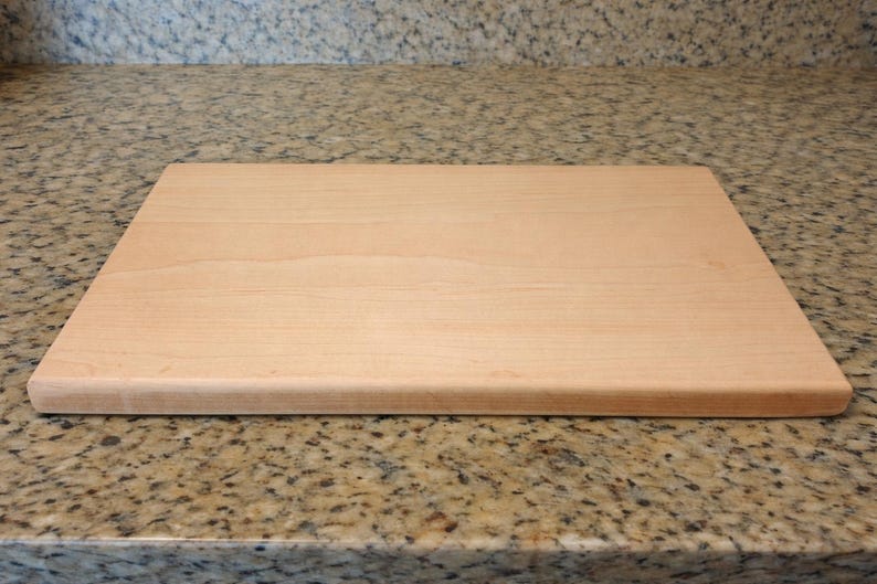 Maple cutting board on a granite countertop