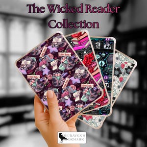May include: A set of four rectangular e-reader cases featuring The Wicked Reader Collection text. The designs include raccoons reading books, stacked pink and red books, skulls with candles, and floral patterns with lipstick icons on a clear base.
