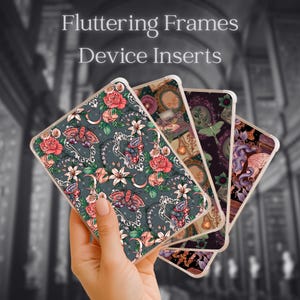 May include: Four rectangular device inserts labeled Fluttering Frames Device Inserts. Each insert features a distinct pattern including moths, roses, lilies, ornate frames, and crescent moons in shades of pink, green, purple, and dark gray.