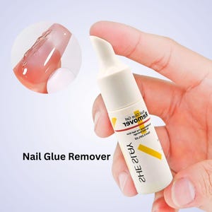 May include: A white and yellow nail glue remover bottle is held in a hand. The bottle has the words "Nail Glue Remover" printed on it. A close-up of a nail with gel is in the background.