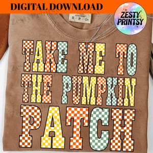 May include: A brown t-shirt with the text "TAKE ME TO THE PUMPKIN PATCH" in a checkered pattern of orange, yellow, and green. The shirt has a crew neck and short sleeves. The words "DIGITAL DOWNLOAD" are at the top.